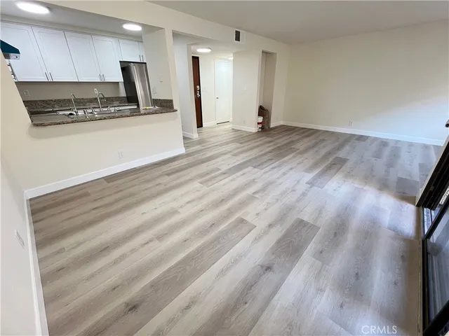 a view of kitchen with wooden floor