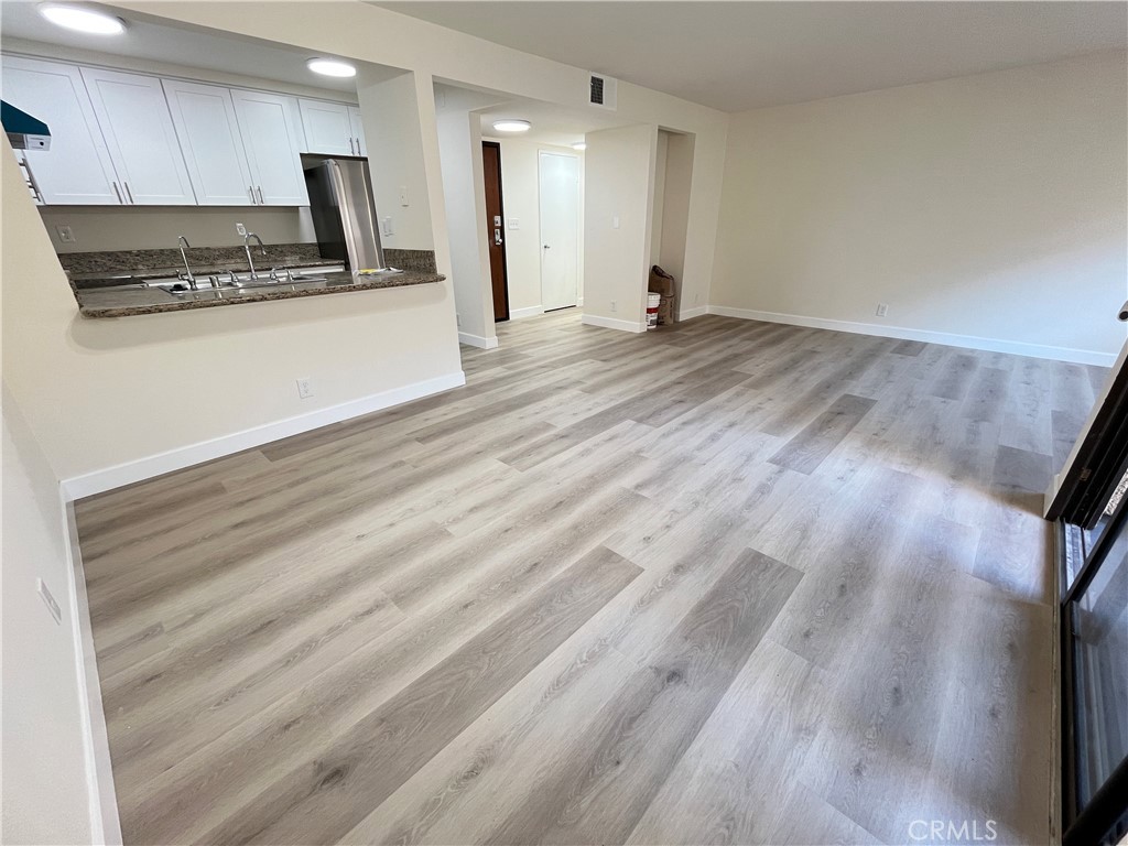 435 South Virgil Avenue, Unit 209 Los Angeles, CA 90020 - Photo 5 of 31 a view of kitchen with wooden floor