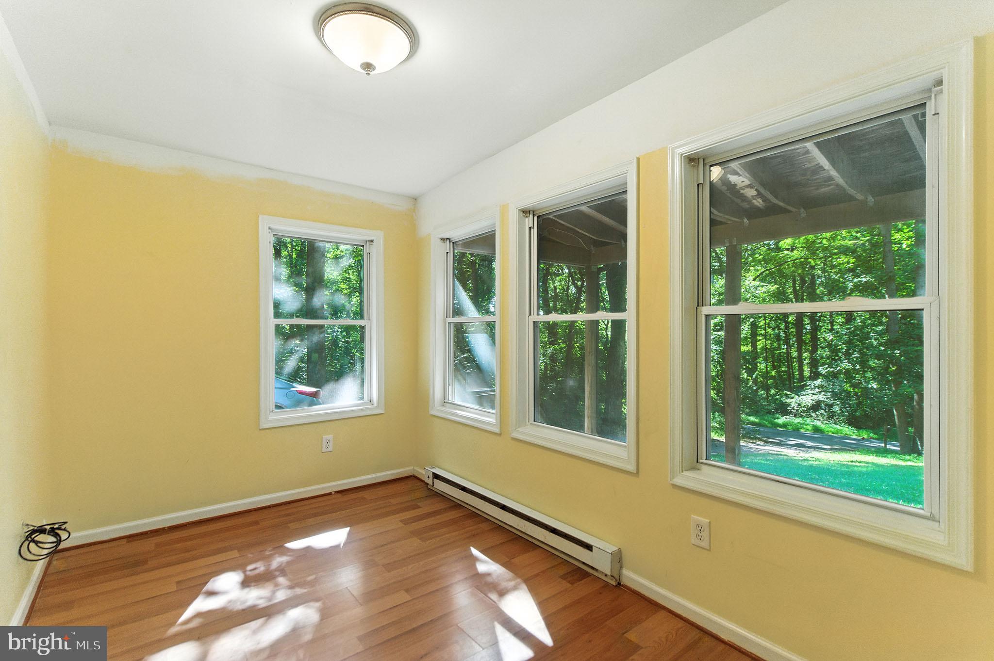 106 Inca Road Linden, VA 22642 - Photo 5 of 17 an empty room with wooden floor and windows