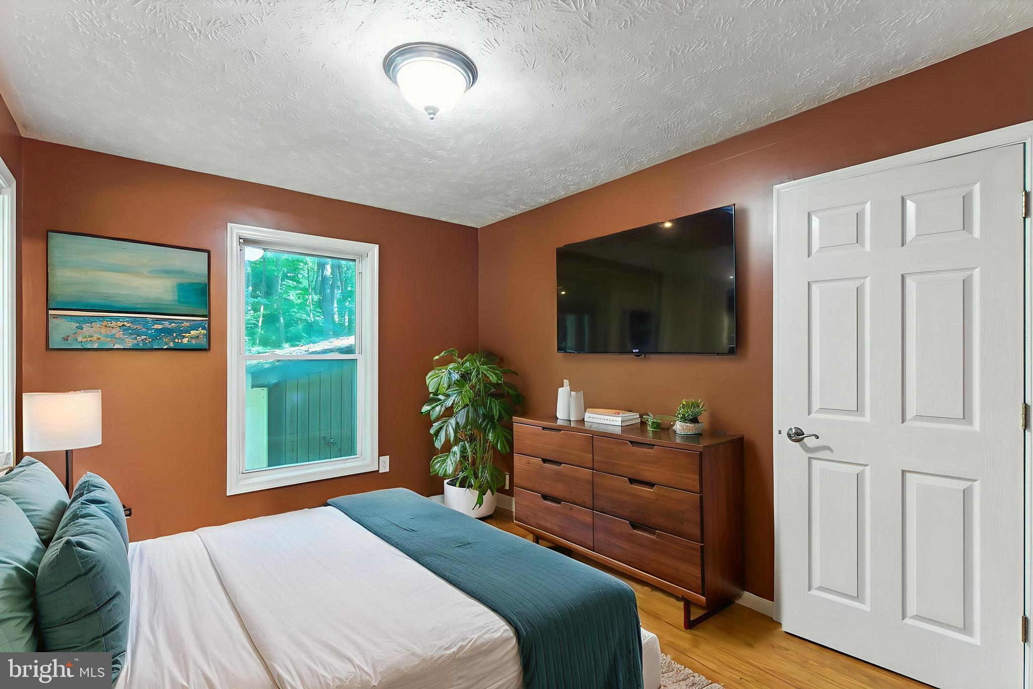 106 Inca Road Linden, VA 22642 - Photo 10 of 17 a bedroom with furniture and flat screen tv