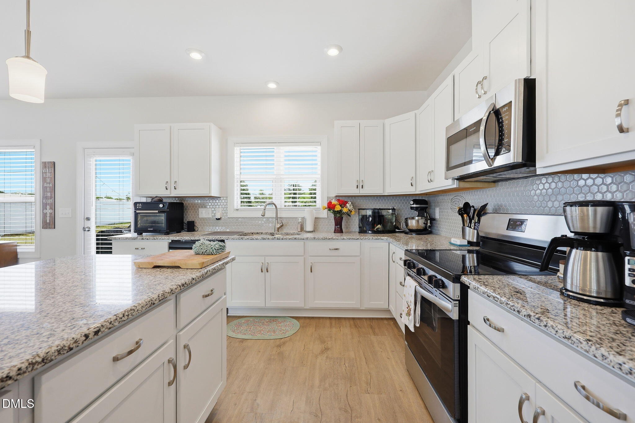 104 Kavanaugh Road Wake Forest, NC 27587 - Photo 12 of 36 a kitchen with stainless steel appliances granite countertop a stove sink and cabinets