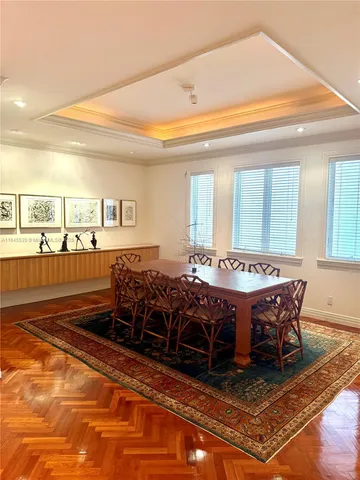 a living room with furniture and a view of kitchen