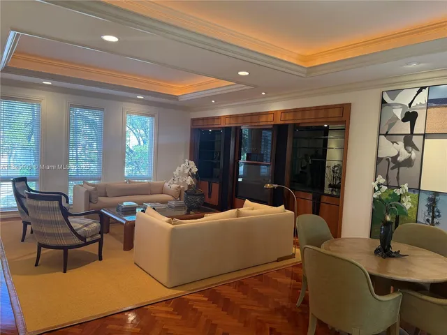 a kitchen with kitchen island granite countertop a sink stove and refrigerator