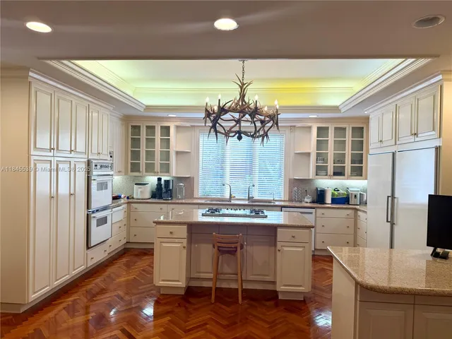 a view of a livingroom with furniture and floor to ceiling window