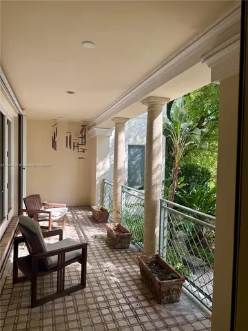 a spacious bathroom with a tub sink and mirror