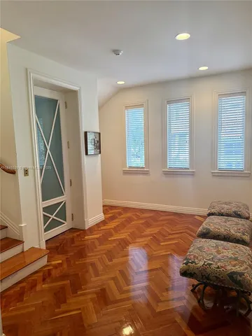 a bathroom with a granite countertop tub sink and mirror