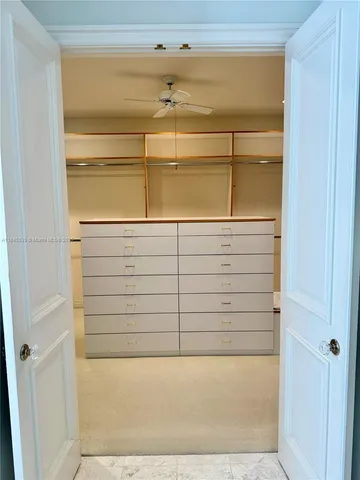 a living room with furniture gym equipment and a rug