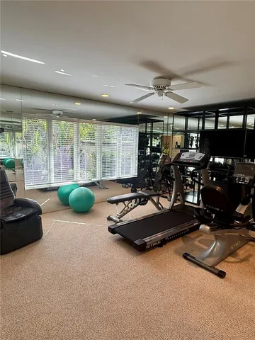 a room with gym equipment and a large window