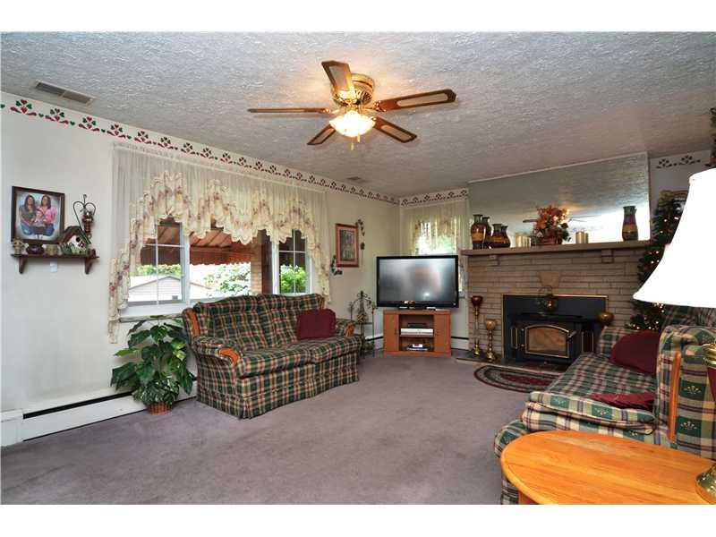 613 Duss Avenue Rochester, PA 15074 - Photo 2 of 15 Living Room. Large picture window for plenty of sunshine. Warm the home up with the wood burner insert in the fireplace. Plenty of room for everyone!