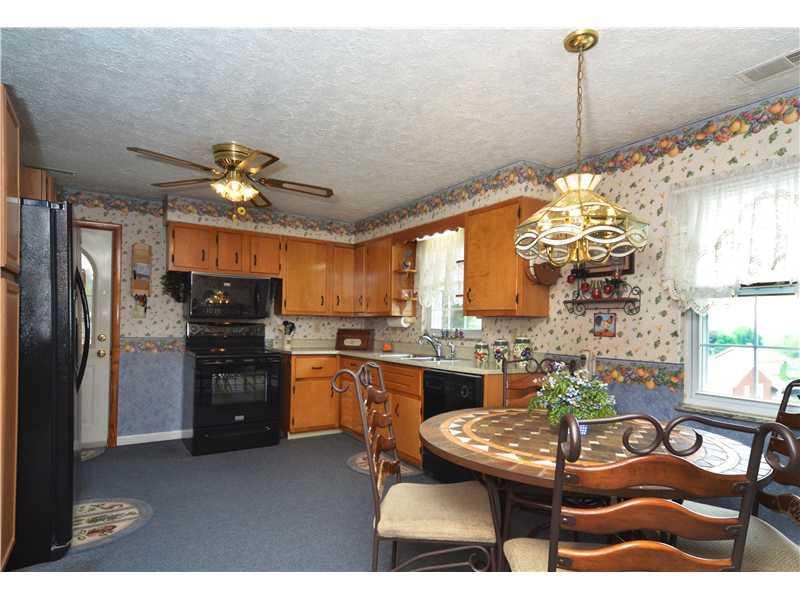 613 Duss Avenue Rochester, PA 15074 - Photo 4 of 15 Kitchen. Plenty of room to cook up a feast! Side door leads out to the composite deck with an in ground pool. Great for easy entertaining!