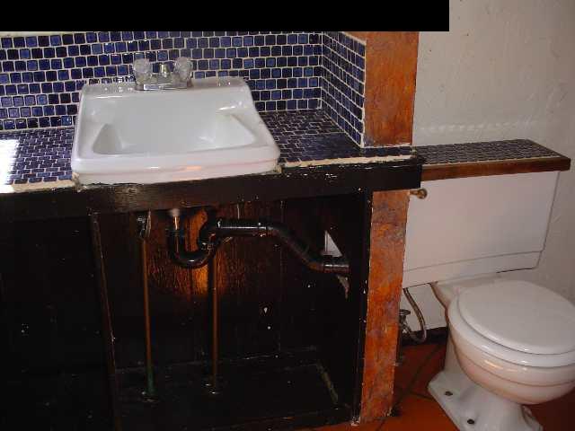 497 Kawelo Road Haiku, HI 96708 - Photo 11 of 18 a bathroom with a sink and a toilet