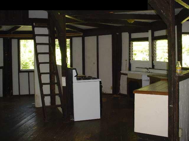 497 Kawelo Road Haiku, HI 96708 - Photo 9 of 18 a view of kitchen with furniture and wooden floor