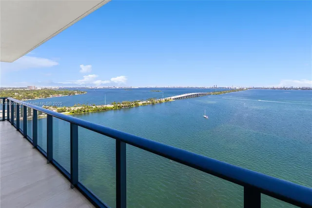 a view of a lake from a balcony