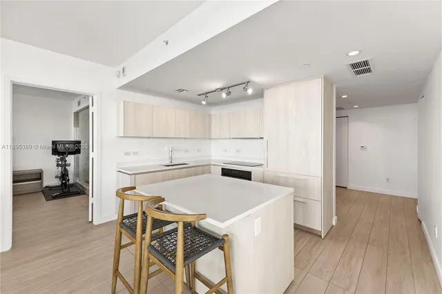 a view of kitchen with furniture and wooden floor
