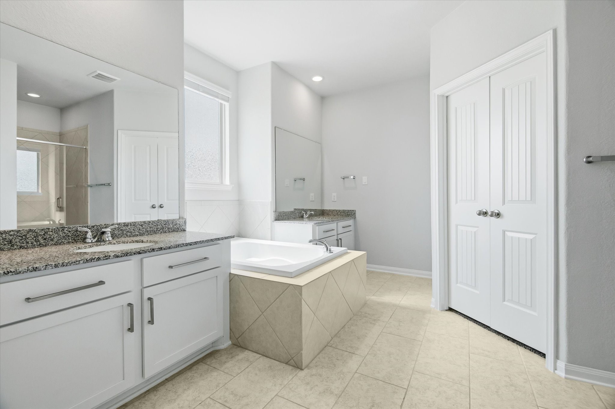 16738 Rockwall Street Conroe, TX 77303 - Photo 18 of 42 A different perspective of the ensuite bath reveals the clean finishes and soft natural light that create a calming atmosphere.