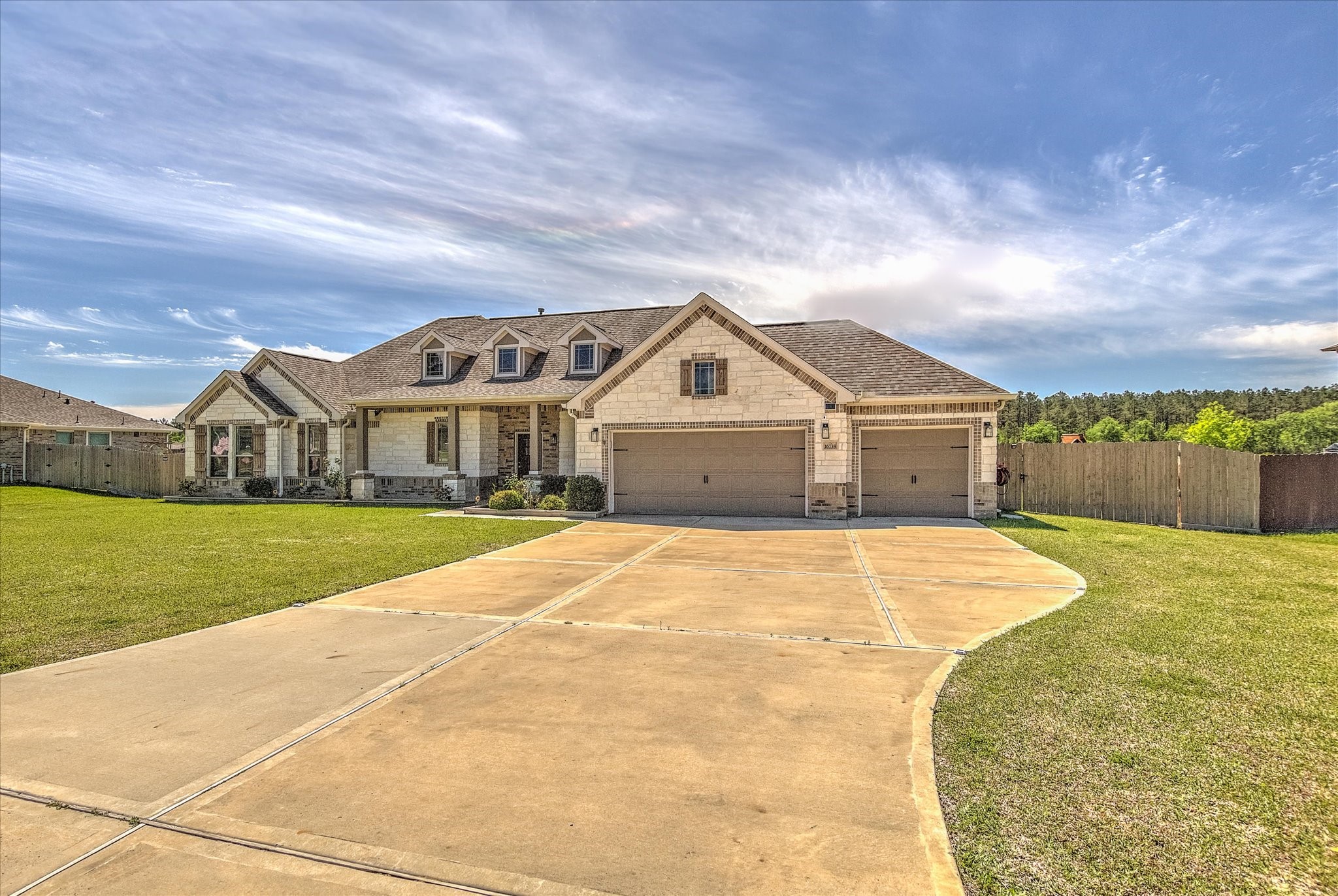 16738 Rockwall Street Conroe, TX 77303 - Photo 2 of 42 The large homesite offers generous yard space and strong curb appeal, creating an impressive first impression.