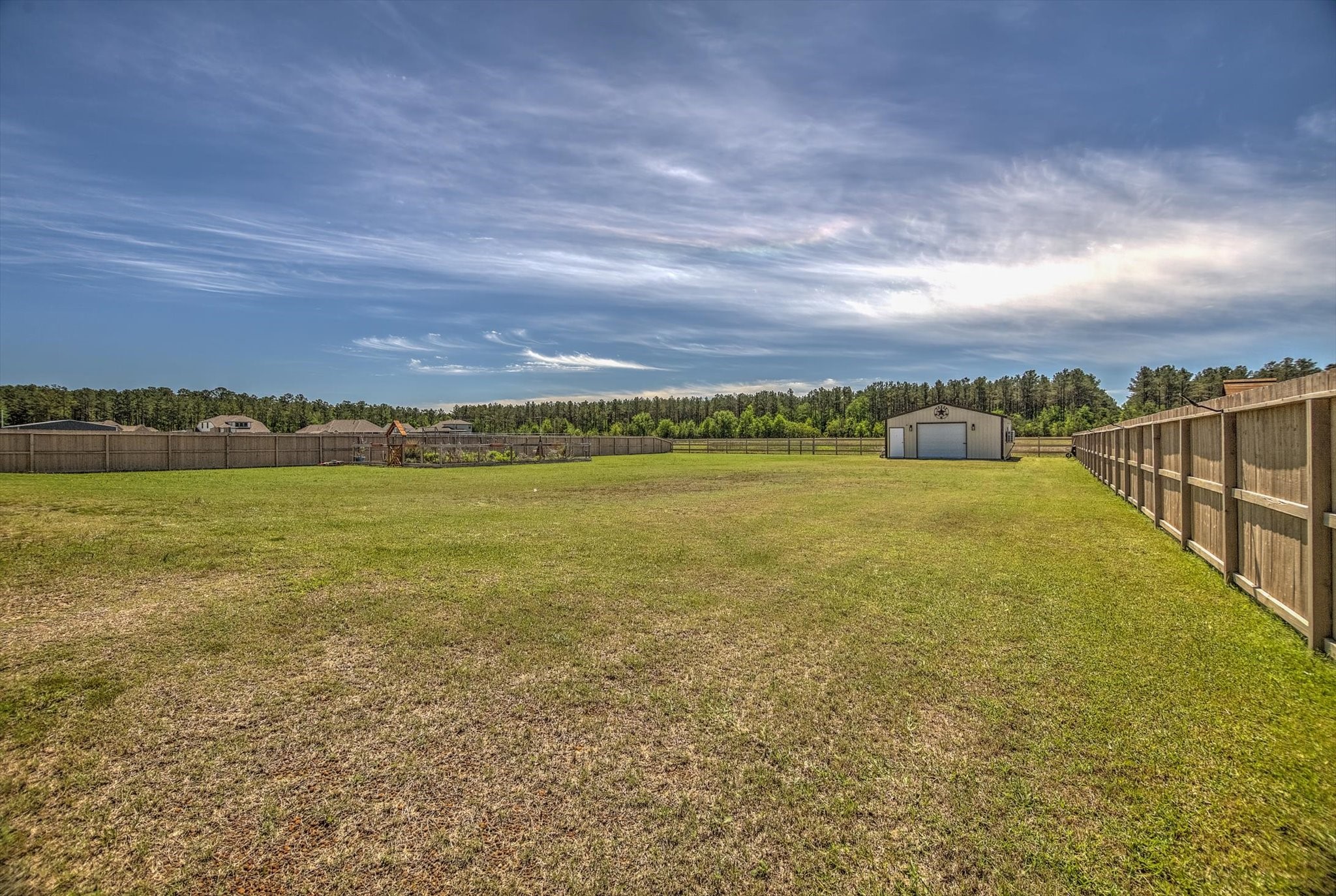 16738 Rockwall Street Conroe, TX 77303 - Photo 33 of 42 The backyard unfolds like a blank canvas with room to dream big and build even bigger.