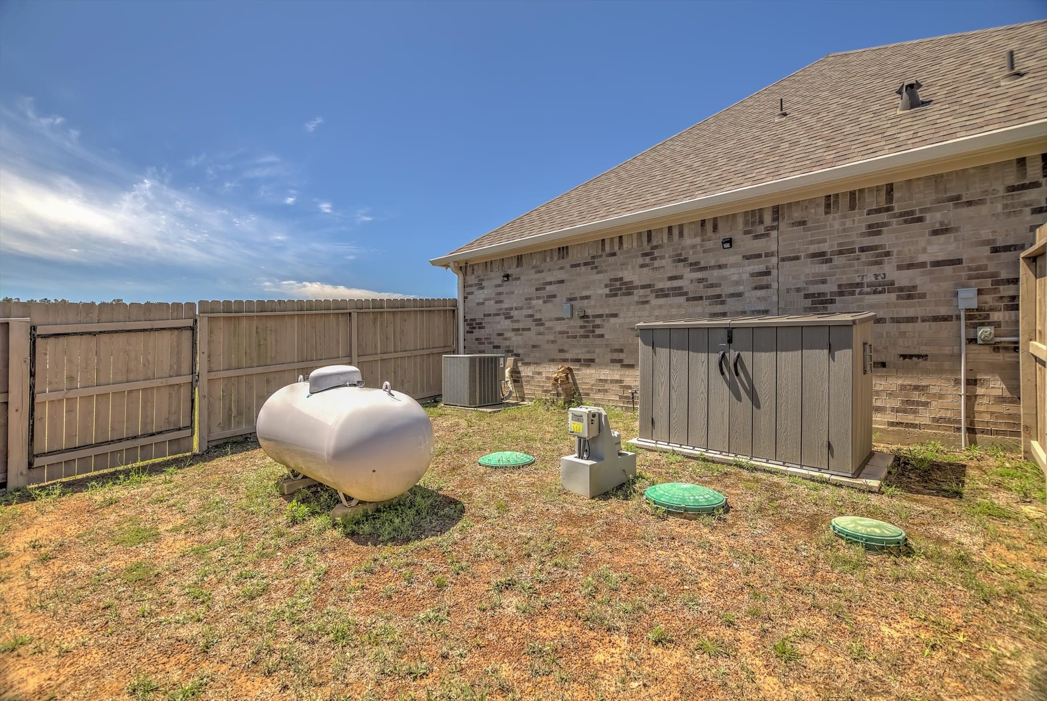 16738 Rockwall Street Conroe, TX 77303 - Photo 39 of 42 Adding to the home’s functionality is an aerobic septic system, designed for efficient, low-maintenance performance. It’s a practical feature that supports the property’s scale while allowing you to enjoy all the benefits of acreage living without sacrificing modern convenience.