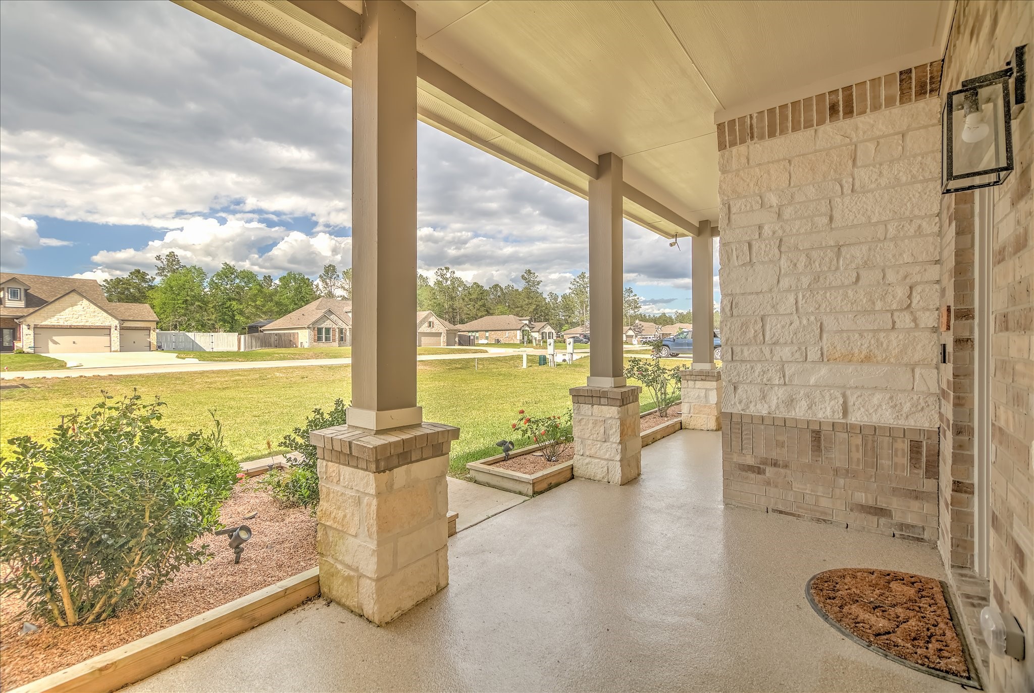 16738 Rockwall Street Conroe, TX 77303 - Photo 4 of 42 The spacious covered front porch with sturdy columns and landscaped beds, offers a comfortable place to relax while enjoying peaceful neighborhood views. The extended porch enhances both curb appeal and outdoor living.