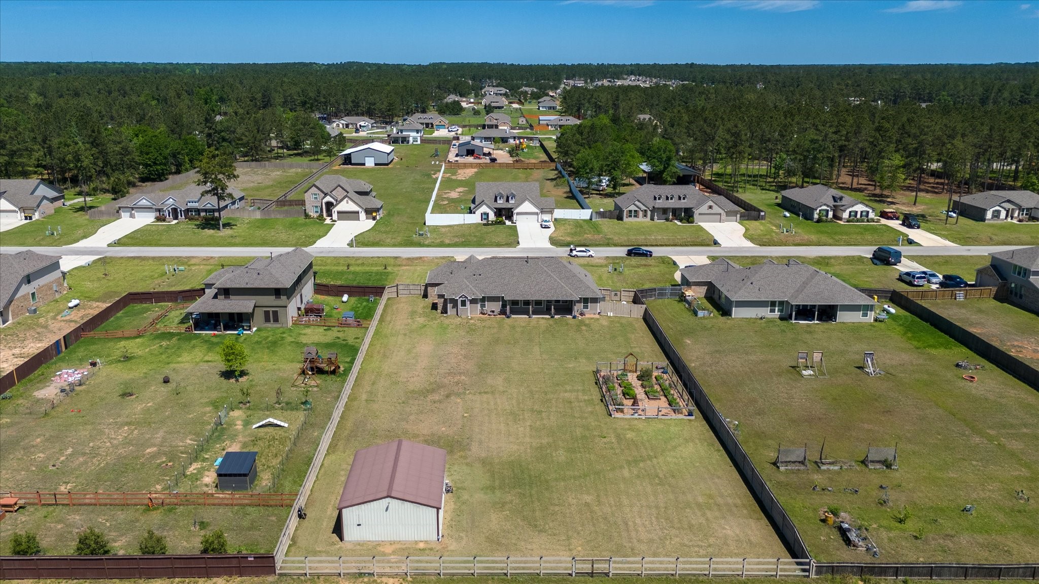 16738 Rockwall Street Conroe, TX 77303 - Photo 42 of 42 This perspective also showcases the surrounding neighborhood, illustrating the generous lot sizes, open space, and peaceful setting that define the community.