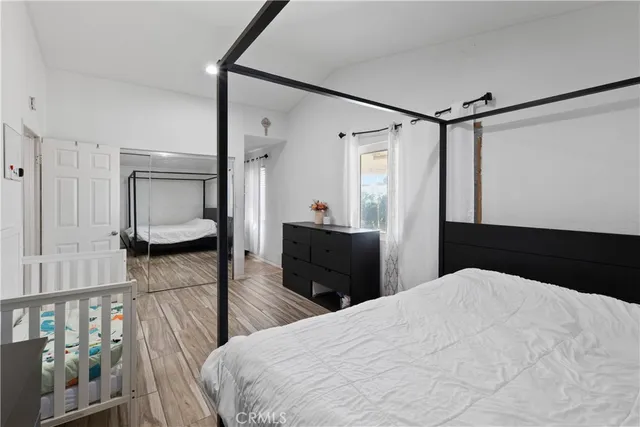 a bedroom with a bed and a walk in closet