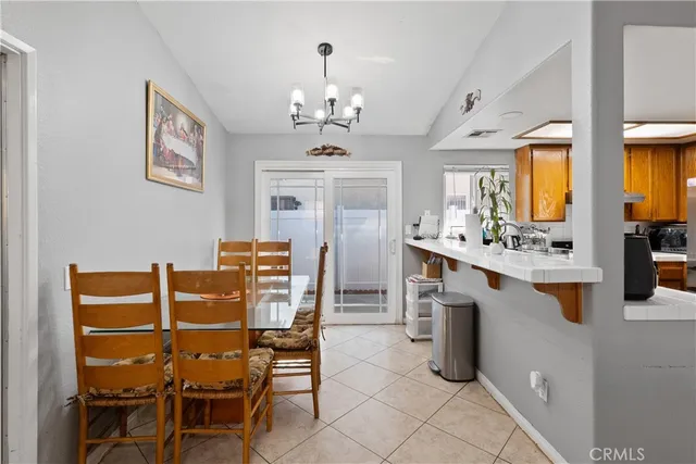 a view of a dining room with furniture and window