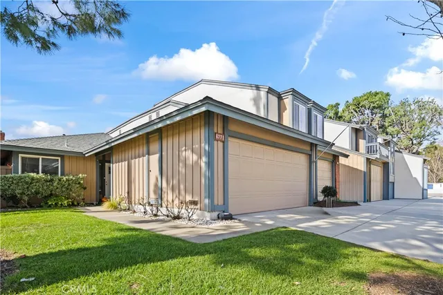 a front view of house with yard and outdoor seating