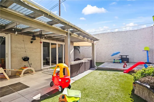 a gym hall with furniture and a potted plant