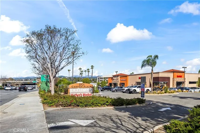 a city street lined with buildings and trees