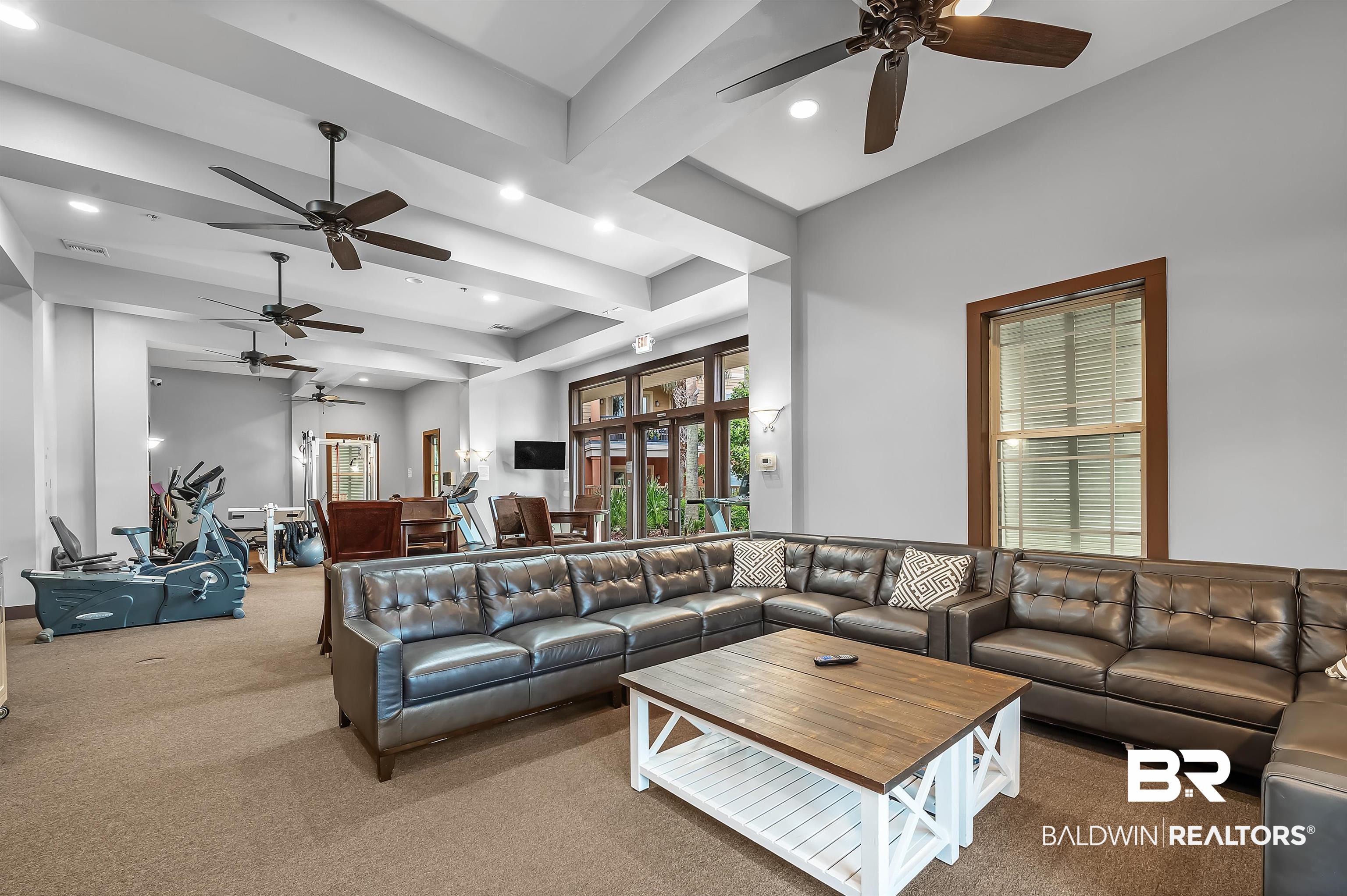 1430 Regency Road, Unit A301 Gulf Shores, AL 36542 - Photo 40 of 47 Carpeted living room featuring ceiling fan