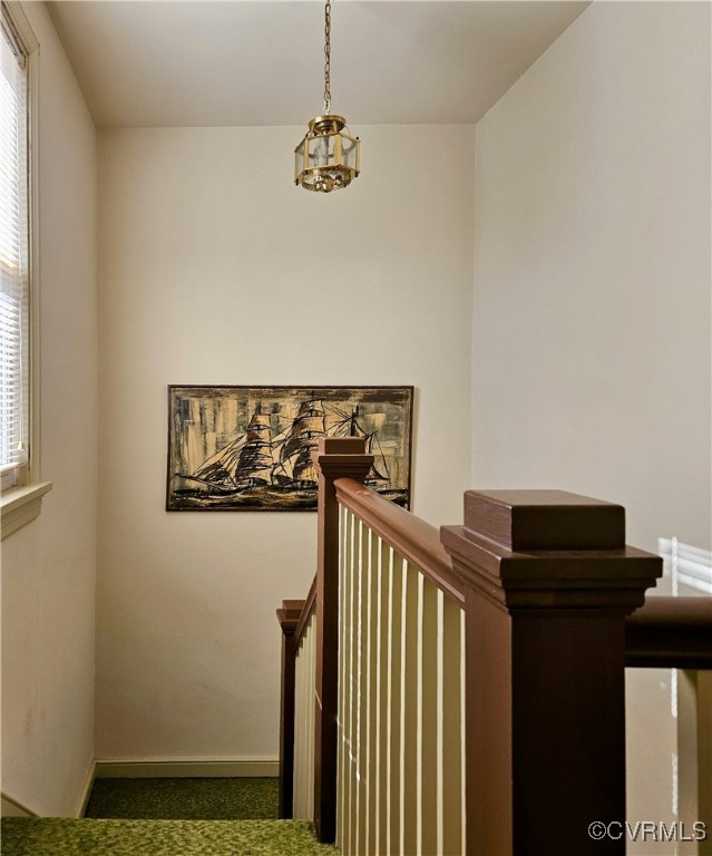 3410 Stuart Avenue Richmond, VA 23221 - Photo 18 of 43 a view of a hallway with wooden floor and stairs