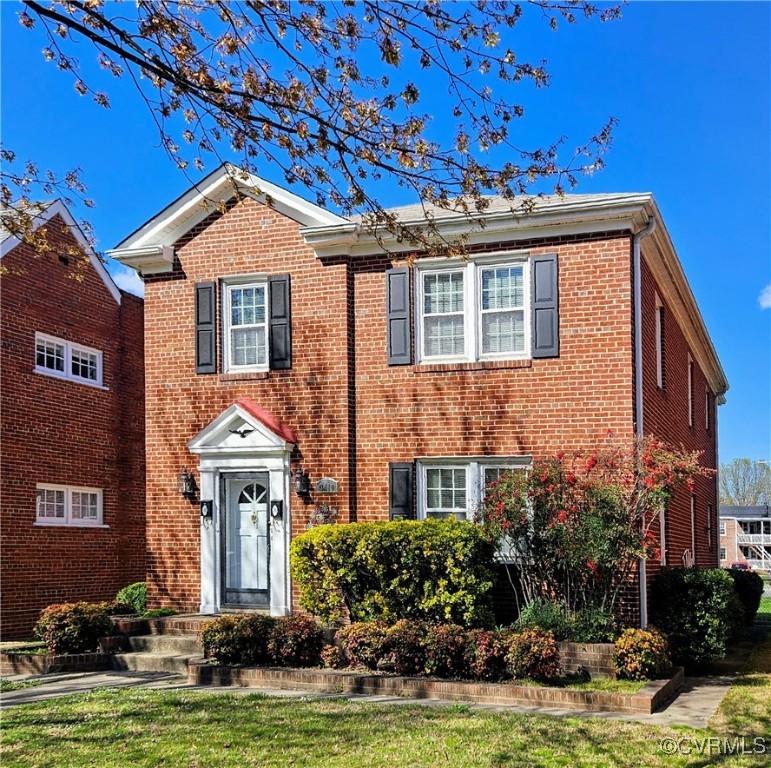 3410 Stuart Avenue Richmond, VA 23221 - Photo 2 of 43 a front view of a house with a yard and garage