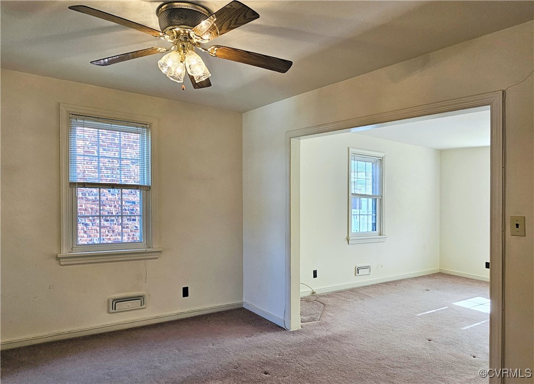 3410 Stuart Avenue Richmond, VA 23221 - Photo 23 of 43 an empty room with windows and fan