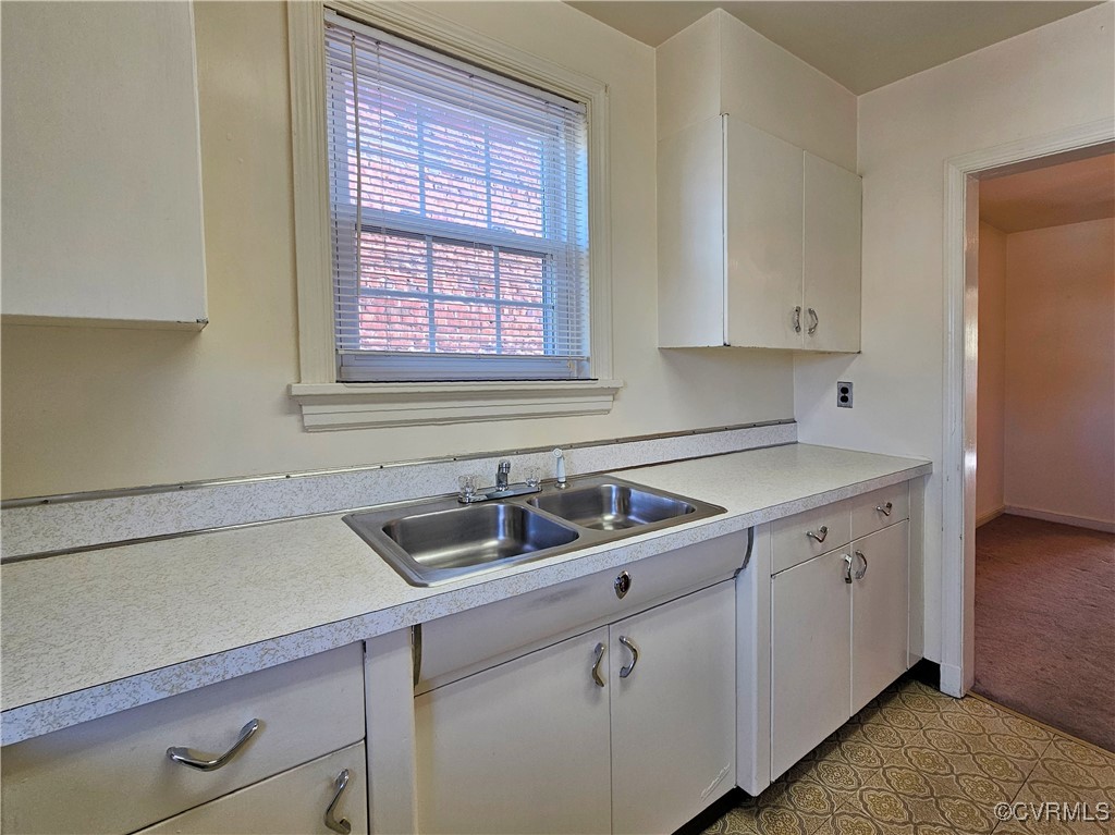 3410 Stuart Avenue Richmond, VA 23221 - Photo 25 of 43 a kitchen with a sink and cabinets