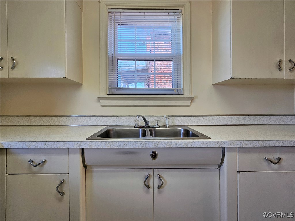 3410 Stuart Avenue Richmond, VA 23221 - Photo 26 of 43 a view with a sink and cabinets