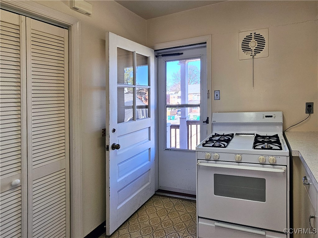 3410 Stuart Avenue Richmond, VA 23221 - Photo 27 of 43 a kitchen with stove and white cabinets