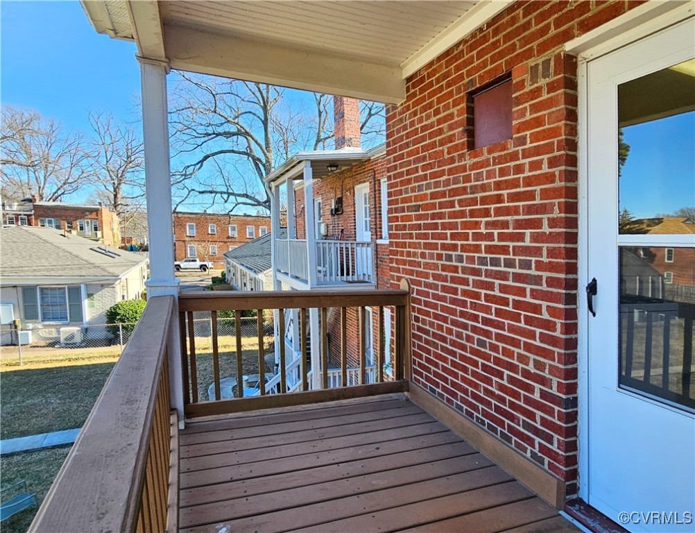 3410 Stuart Avenue Richmond, VA 23221 - Photo 28 of 43 a view of a brick house with large windows