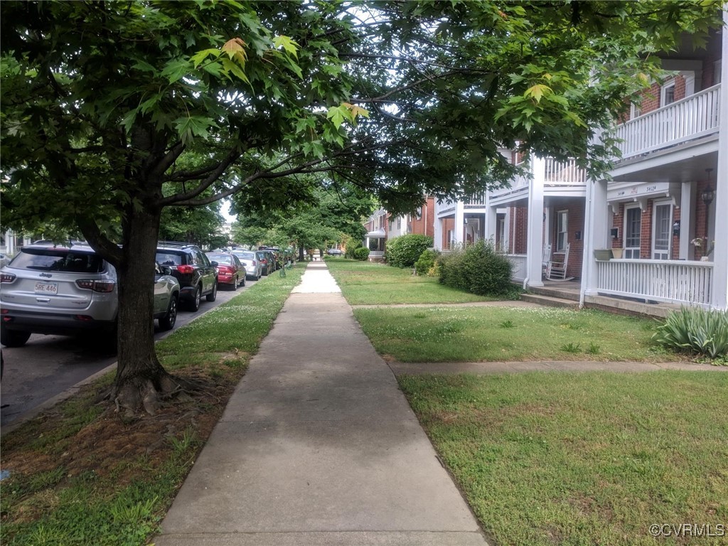 3410 Stuart Avenue Richmond, VA 23221 - Photo 3 of 43 a front view of a house with a yard and trees
