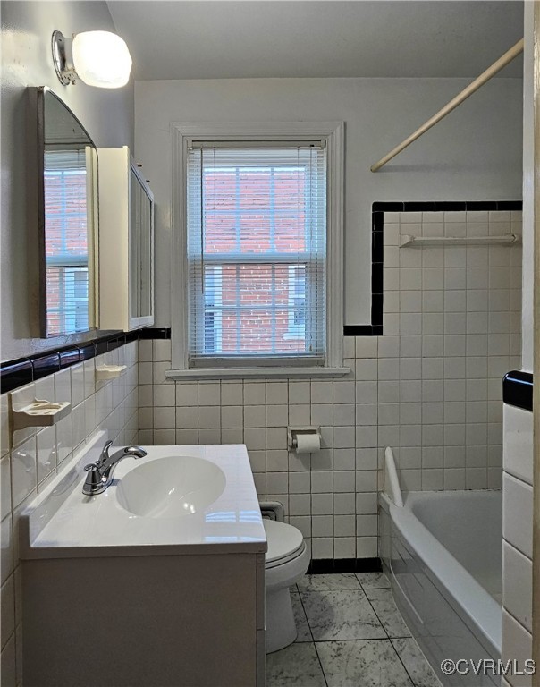 3410 Stuart Avenue Richmond, VA 23221 - Photo 34 of 43 a bathroom with a sink and a bathtub
