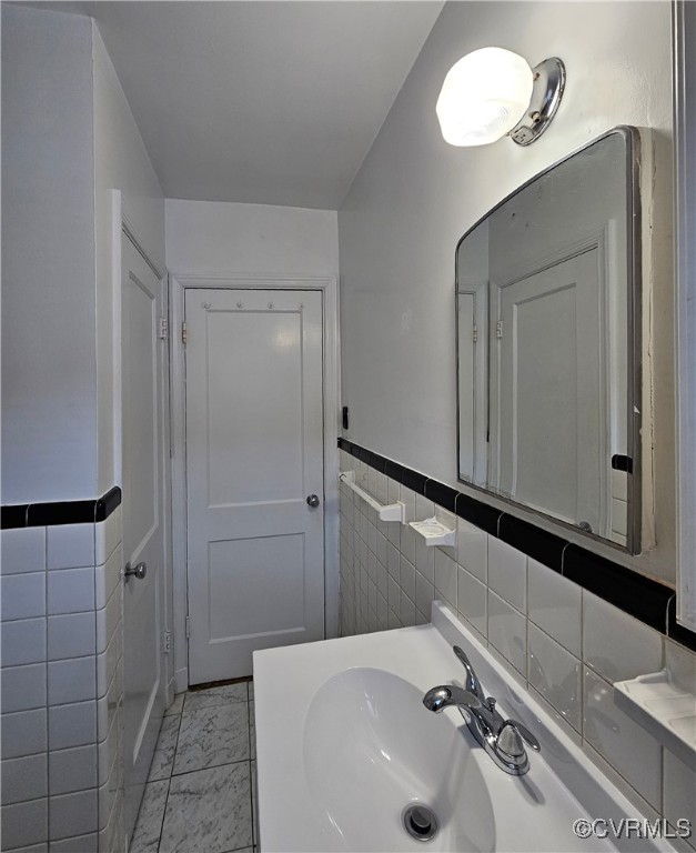 3410 Stuart Avenue Richmond, VA 23221 - Photo 35 of 43 a bathroom with a sink and a mirror