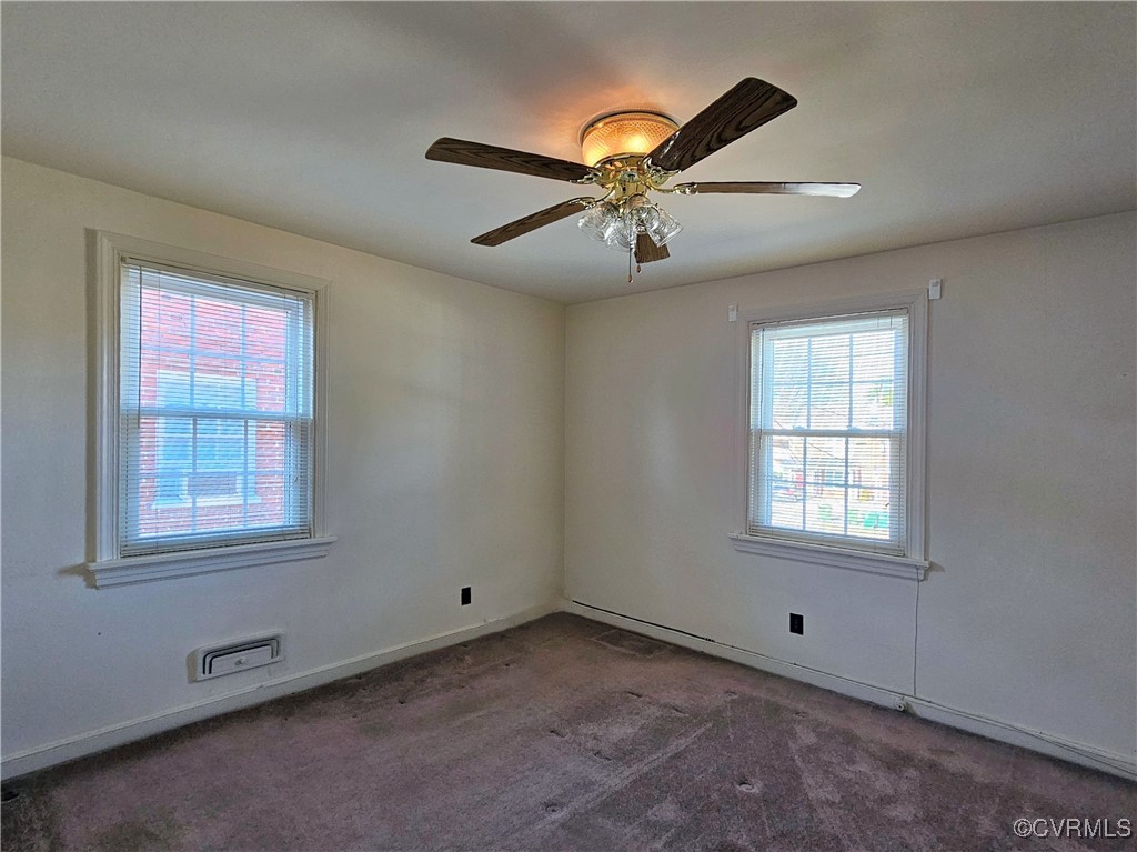 3410 Stuart Avenue Richmond, VA 23221 - Photo 36 of 43 an empty room with windows and fan