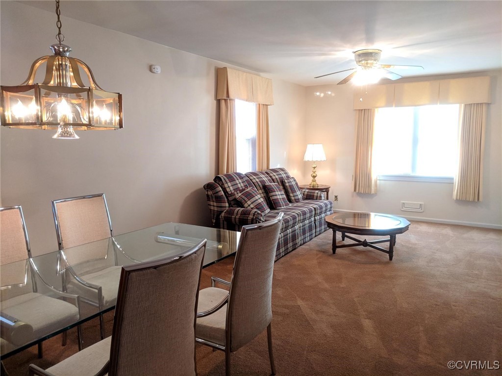 3410 Stuart Avenue Richmond, VA 23221 - Photo 5 of 43 a living room with furniture and a chandelier