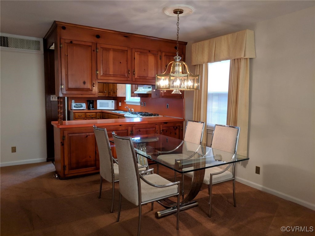 3410 Stuart Avenue Richmond, VA 23221 - Photo 6 of 43 a dining room with furniture and window