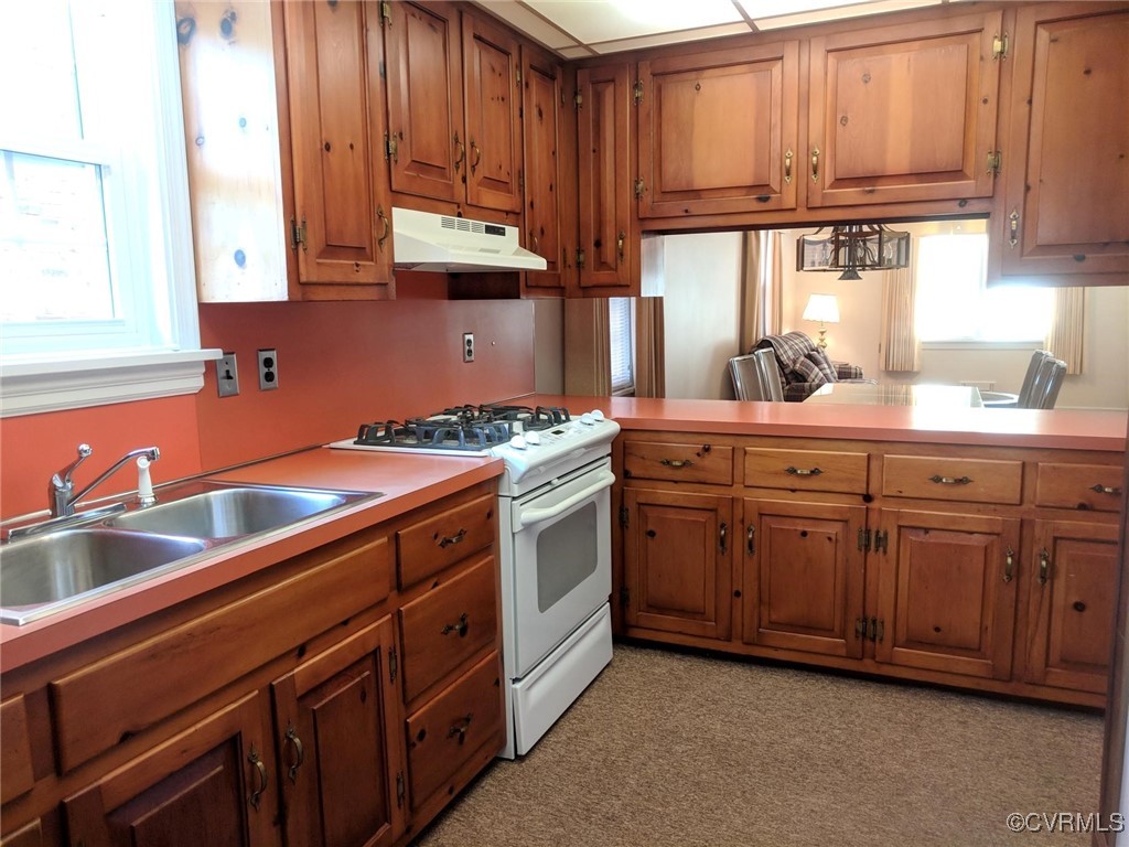 3410 Stuart Avenue Richmond, VA 23221 - Photo 8 of 43 a kitchen with stainless steel appliances granite countertop a sink and cabinets
