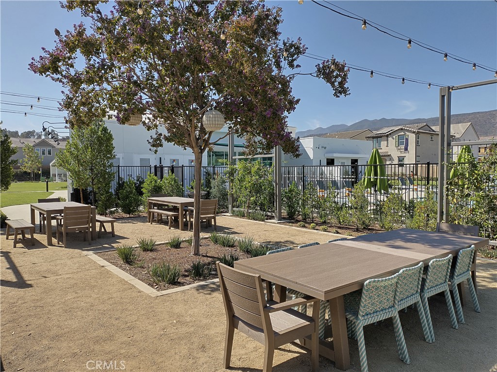 2600 Sprout Lane Corona, CA 92883 - Photo 20 of 30 a view of a patio with table and chairs and potted plants