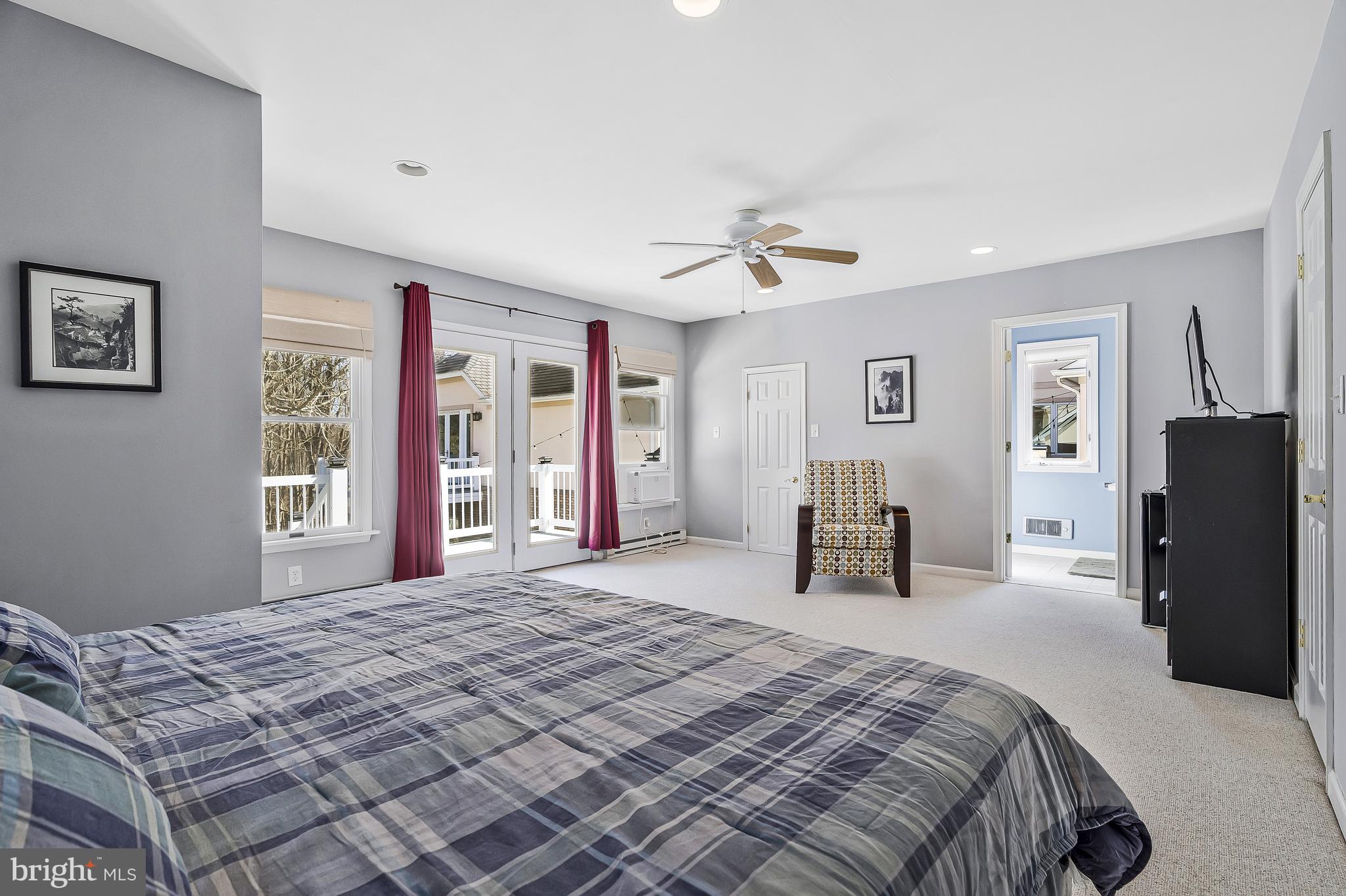 1246 Rachel Road McLean, VA 22101 - Photo 54 of 68 a bedroom with a large bed and a chandelier