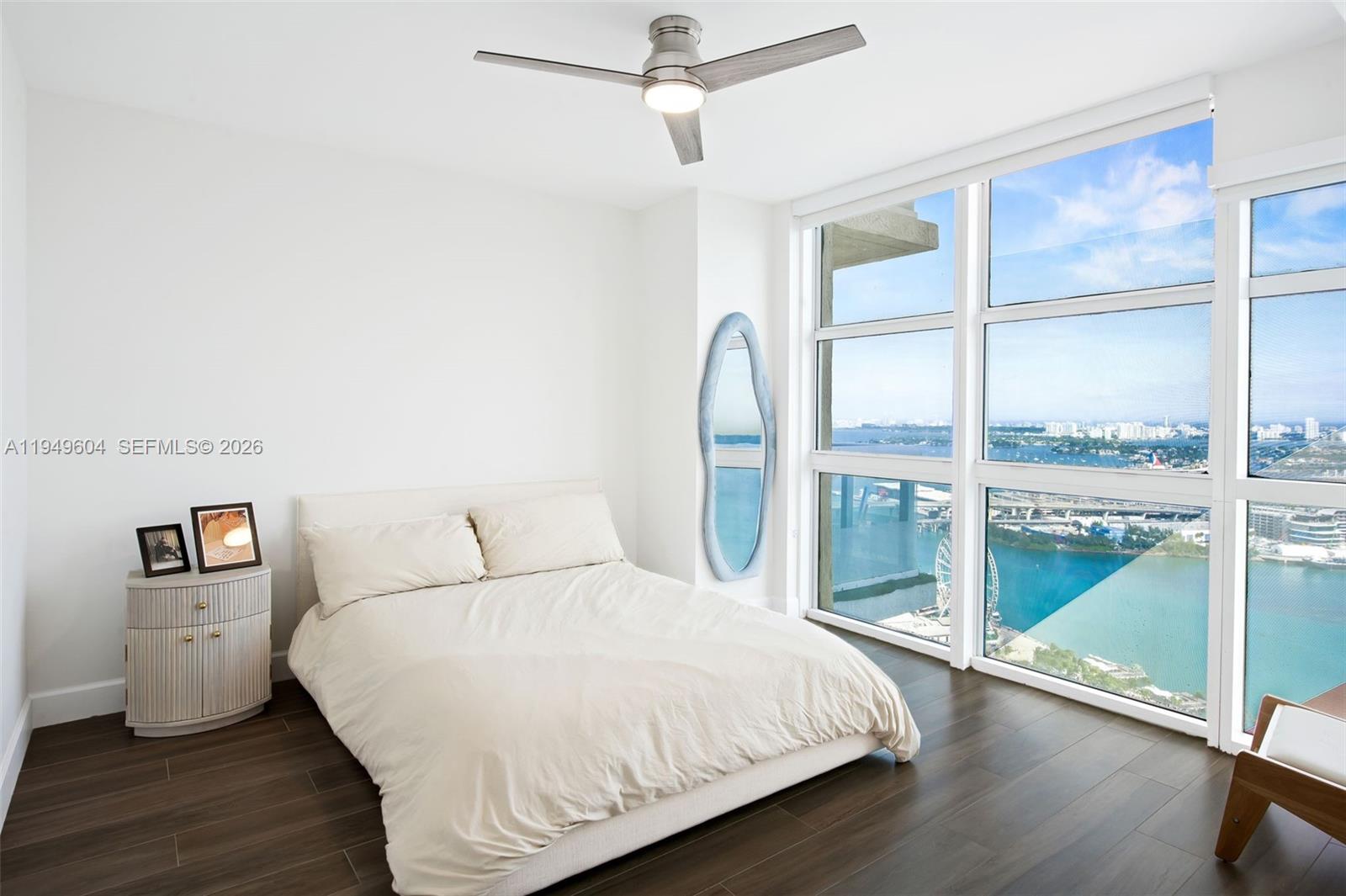 50 Biscayne Boulevard, Unit 3904 Miami, FL 33132 - Photo 16 of 21 a bedroom with a bed and a large window