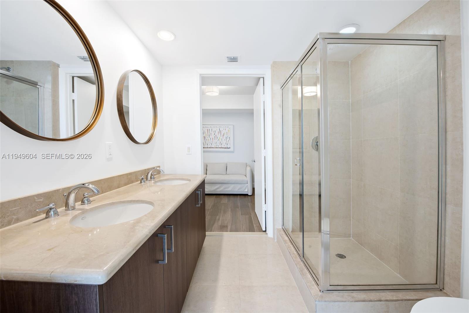 50 Biscayne Boulevard, Unit 3904 Miami, FL 33132 - Photo 19 of 21 a bathroom with a double vanity sink mirror and bathtub
