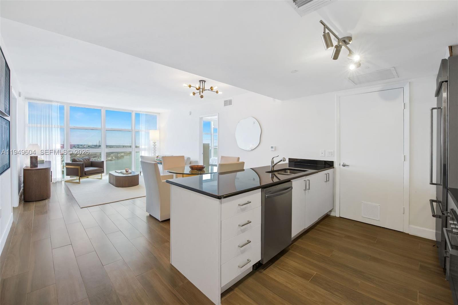 50 Biscayne Boulevard, Unit 3904 Miami, FL 33132 - Photo 3 of 21 a kitchen with stainless steel appliances granite countertop a stove and a sink