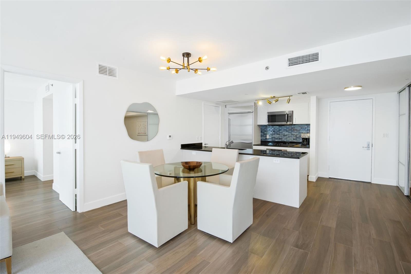 50 Biscayne Boulevard, Unit 3904 Miami, FL 33132 - Photo 5 of 21 a kitchen with stainless steel appliances a stove a refrigerator and a microwave